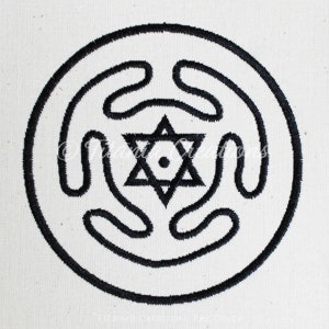 May include: Black and white embroidered design of a six-pointed star inside a circle with a swirling pattern.