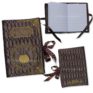 May include: Three brown quilted notebook covers with ribbon ties. The covers are decorated with gold embroidery. One cover features the word "POTIONS" and a cauldron with steam rising from it. Another cover has a simple design with a small heart. The third cover is blank.