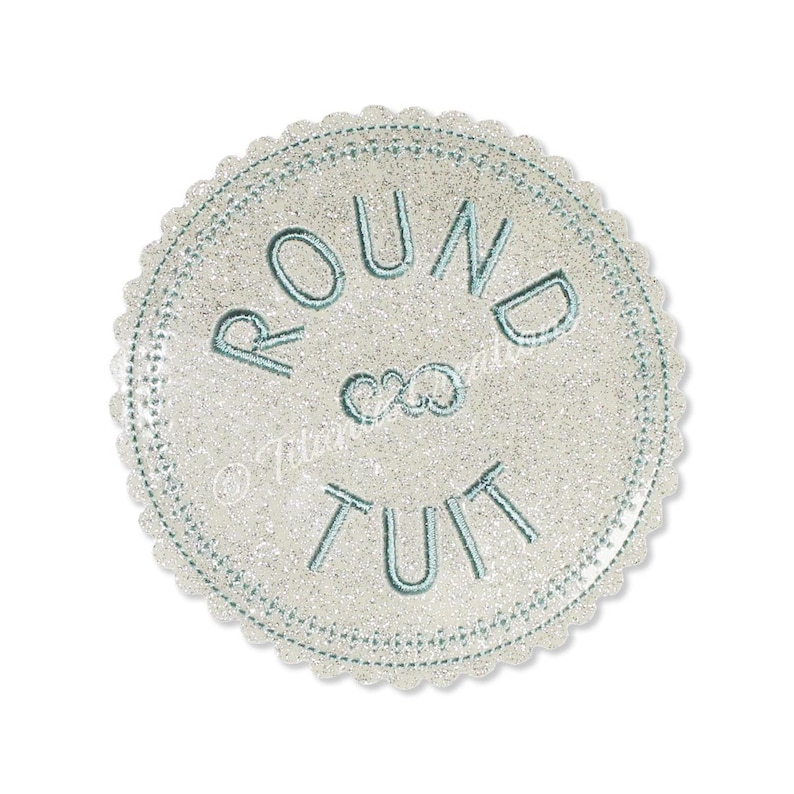 May include: A white round sticker with a blue glitter finish and the text "ROUND & ROUND" in blue embroidery.