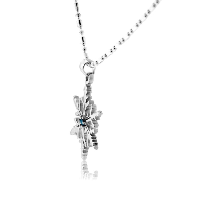 Sterling Silver Snowflake Necklace with Blue Topaz Accent Stone