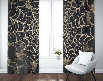 May include: A pair of floor-length curtains featuring a black background with a gold spiderweb pattern and scattered leaf motifs. The curtains are hung on a silver rod with metal grommets at the top, displaying a repeating web design.