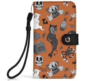 May include: A rectangular orange wallet case with a black wrist strap and a snap button closure. The surface features a repeating pattern of black and white illustrations including skulls, a clown, a ghost, a devil figure, a spider, and a book labeled Hocus Pocus.