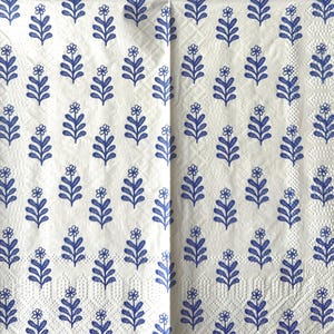 May include: A white ceramic mug with a black handle and the text "But First, Coffee" in a black, bold font. The mug is on a white surface.