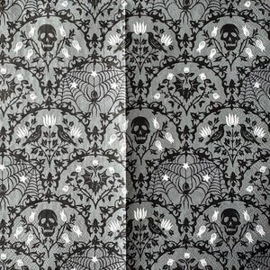 May include: A gray and black Halloween-themed patterned design featuring skulls, spiderwebs, bats, and crows. The repeating pattern includes floral elements and is suitable for seasonal decor.