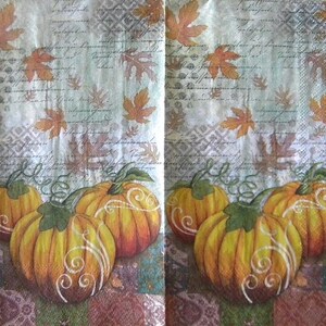 May include: A paper napkin featuring a repeating pattern of orange pumpkins with white swirl accents, scattered autumn leaves in shades of gold and brown, and a background of faded cursive script text layered over a subtle geometric grid pattern.
