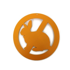 May include: Orange round sign with a diagonal line through the center. The sign has a silhouette of a rabbit inside.