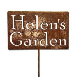 This is a custom garden stake sign. It has a face plate that is rectangle in size. It is attached to a steel rod.