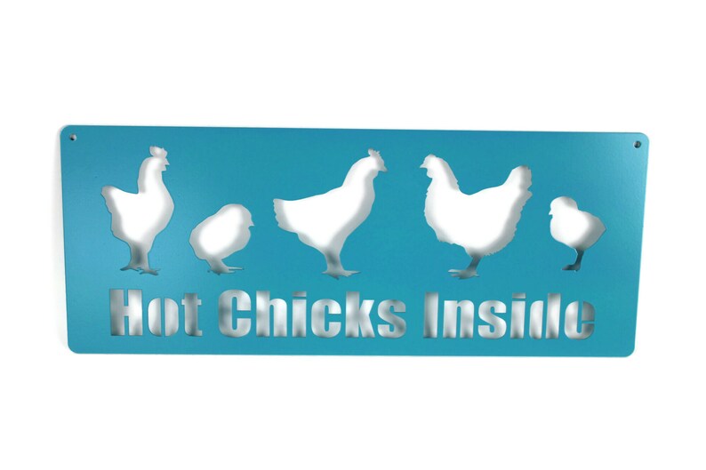 May include: A turquoise blue metal sign with a white silhouette of five chickens and the text "Hot Chicks Inside".