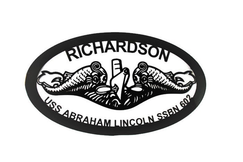 May include: Black and white oval metal sign with the text "RICHARDSON USS ABRAHAM LINCOLN SSBN 602" and a stylized image of a submarine with two dolphins.