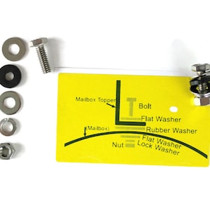 May include: A hardware kit featuring a bolt, washers, and a nut, with a yellow card showing a diagram and text such as "Mailbox Topper" and "Bolt". The components are silver and black.