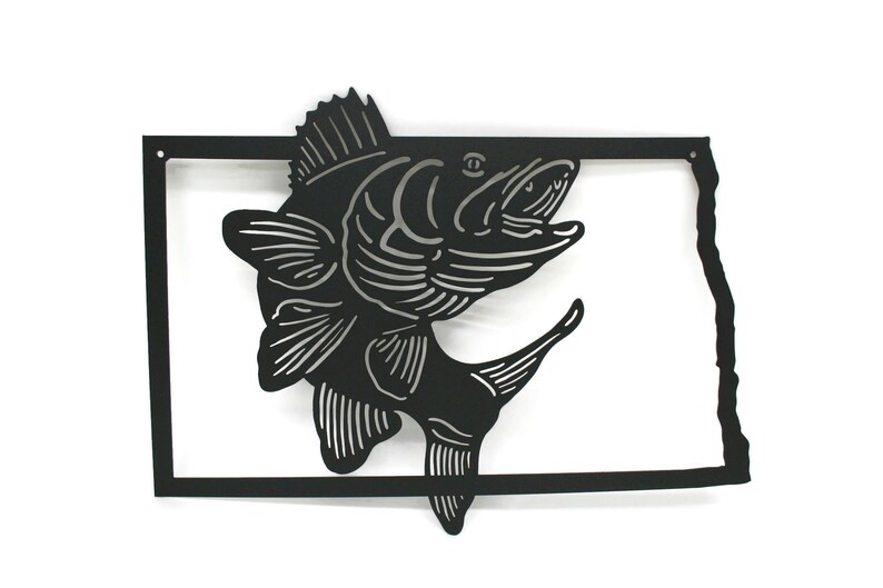 May include: Black metal wall art featuring a leaping fish design within a rectangular frame. The fish is detailed with silver accents, and the frame is shaped like the outline of a state. A decorative piece for fishing enthusiasts.