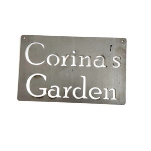 This sign is raw steel for the color. No wire is attached.