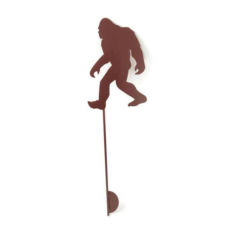 May include: A white ceramic mug with a black handle and the text "But First, Coffee" in a bold, black font. The mug is set against a neutral background, highlighting its simple design.