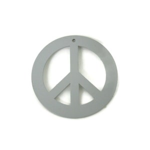 May include: A gray peace sign ornament with a hole at the top for hanging.