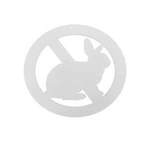 May include: White metal sign with a circle and a diagonal line through it. Inside the circle is a silhouette of a rabbit. The sign is a no rabbits allowed sign.