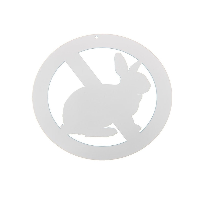 May include: White metal sign with a circle and a diagonal line through it. Inside the circle is a silhouette of a rabbit. The sign is a no rabbits allowed sign.