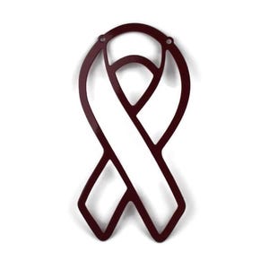 May include: A burgundy metal ribbon cutout, a symbol of awareness. The ribbon has a classic looped design with a central opening. Two small holes are at the top for hanging. The cutout is displayed against a white background.