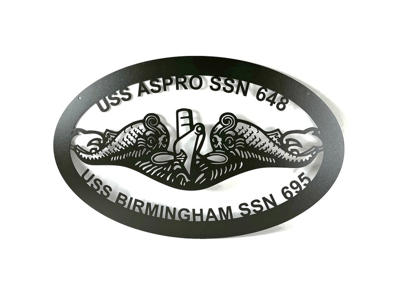 May include: Black metal oval sign with the text "USS ASPRO SSN 648 USS BIRMINGHAM SSN 695" and a stylized image of two dolphins.