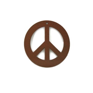 May include: A rusty brown metal peace sign ornament. The peace sign is a circle with a stylized dove inside.