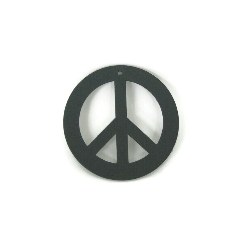 May include: A black peace sign cutout, a symbol of peace and love, is shown against a white background.