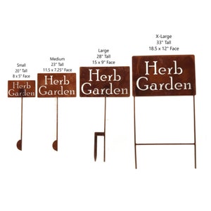 May include: Four sizes of rusty metal herb garden signs. The signs are rectangular with the words "Herb Garden" cut out in white. Sizes range from 20" tall with an 8" x 5" face to 33" tall with an 18.5" x 12" face.