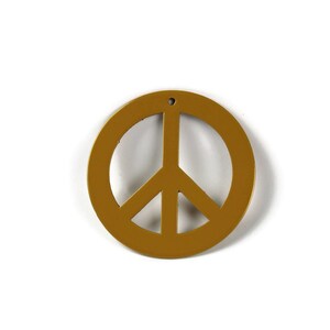 May include: A gold peace sign ornament with a hole at the top for hanging.