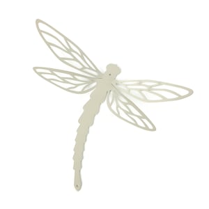 May include: A light beige metal dragonfly wall art. The dragonfly has detailed wing patterns and a segmented body. The wings are outstretched, and the design is cut out, creating an openwork effect. The dragonfly is a decorative item.