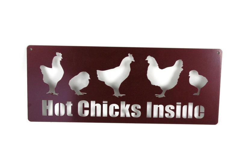 May include: A maroon metal sign with a white silhouette of five chickens and the text "Hot Chicks Inside".