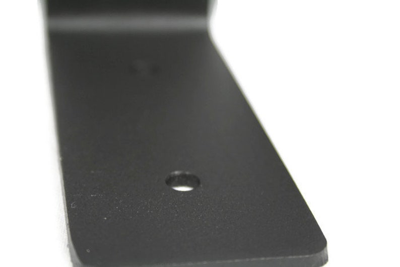 This picture shows one of holes in the bracket. Smooth edges and cuts. Powder coated matte black.