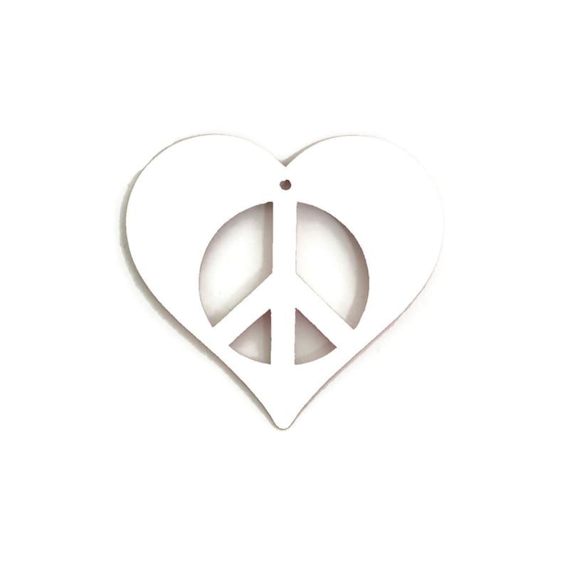 May include: White wooden heart-shaped ornament with a peace sign cutout in the center.