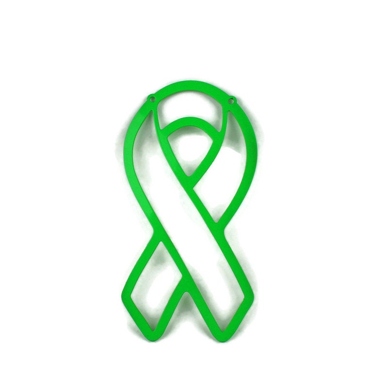 May include: A bright green awareness ribbon cutout, featuring a looped design with a central white space. The ribbon has a smooth, clean finish and is set against a plain white background. The ribbon has two small holes at the top.