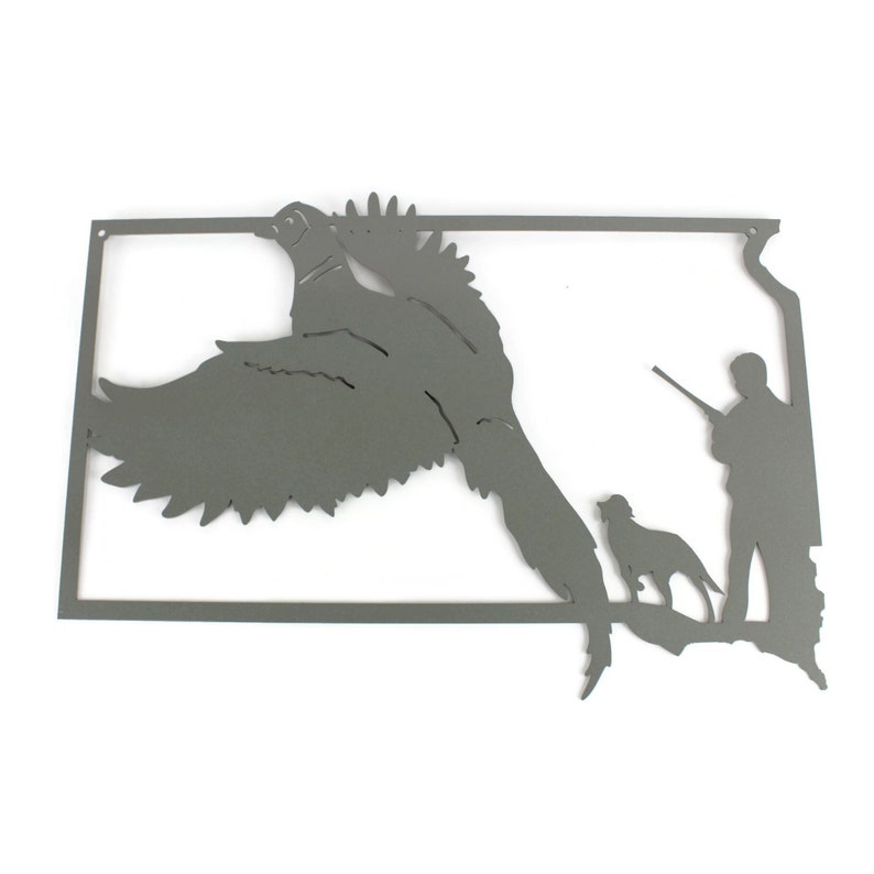 May include: A gray metal wall art piece depicting a pheasant in flight, a hunter with a rifle, and a dog. The artwork is in the shape of a state, with mounting holes at the top.