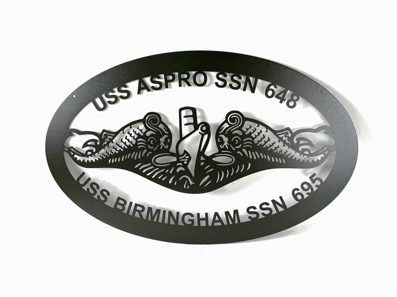May include: Black metal oval sign with the text "USS ASPRO SSN 648" and "USS BIRMINGHAM SSN 695" around a submarine emblem.