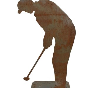 May include: A weathered metal silhouette of a golfer in a putting stance. The figure is bent over, holding a golf club, with a rusty brown finish. The base is a rectangular shape, also with a rusted appearance. Ideal for garden decor.