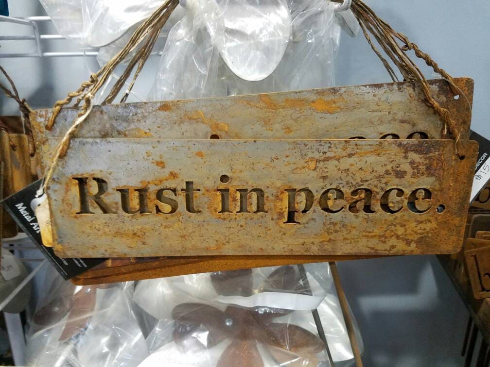 Rust in peace. Rustic hanging metal sign, rusty garden sign, rusty