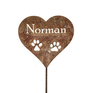 Natural rust stake with Norman and 2 paws on it.