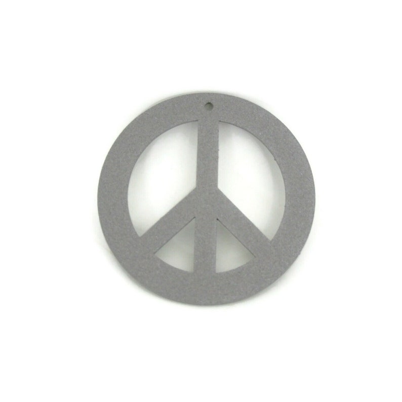 May include: A gray peace sign cutout, made of wood or felt, with a hole at the top for hanging.