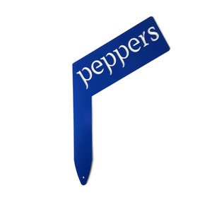 May include: Blue metal garden marker with the word "peppers" in white lettering.