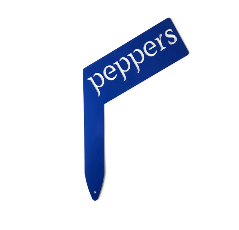 May include: Blue metal garden marker with the word "peppers" in white lettering.