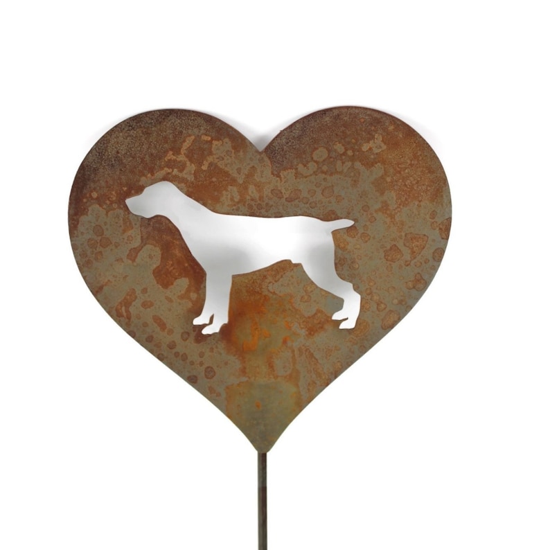 May include: A heart-shaped metal garden stake with a silhouette of a dog. The heart has a rusty brown finish, and the dog silhouette is white. The stake is designed for outdoor use and adds a decorative touch to gardens.