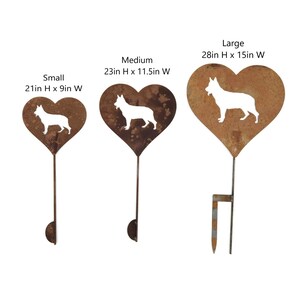 May include: Three heart-shaped metal garden stakes with a dog silhouette. The stakes are in small, medium, and large sizes, measuring 21 inches high by 9 inches wide, 23 inches high by 11.5 inches wide, and 28 inches high by 15 inches wide.