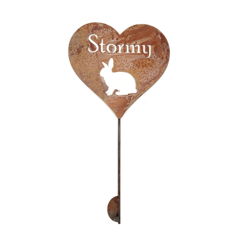 This medium heart stake has a half moon shape kicker on the bottom of the stake to keep it into the ground. Stormy is the name and a rabbit below.