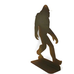 May include: A set of three ceramic mugs with a speckled, matte finish. The mugs are in shades of cream, light gray, and dark gray. Each mug has a simple, minimalist design, perfect for coffee or tea. The mugs are approximately 4 inches tall.