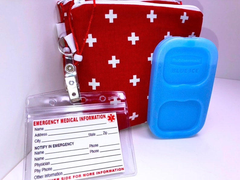 May include: Red fabric pouch with white plus signs, a clear plastic ID holder with the text "EMERGENCY MEDICAL INFORMATION" and a blue ice pack with the text "Rubbermaid BLUE ICE".