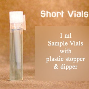 May include: A clear glass vial with a white plastic cap and a plastic dropper. The vial is filled with a clear liquid. The text "Short Vials" is at the top of the image. The text "1 ml Sample Vials with plastic stopper & dropper" is at the bottom of the image.