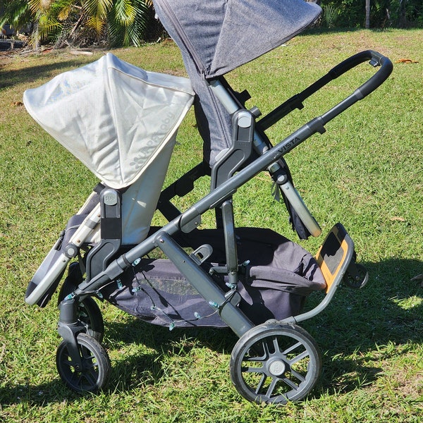 Adattatore per seggiolino per passeggino per bambini sui braccioli inferiori