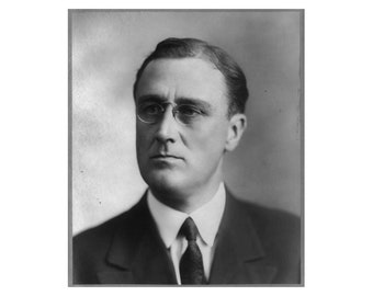 May include: A black and white portrait of a man wearing a suit and tie. He is wearing glasses and has a serious expression on his face.
