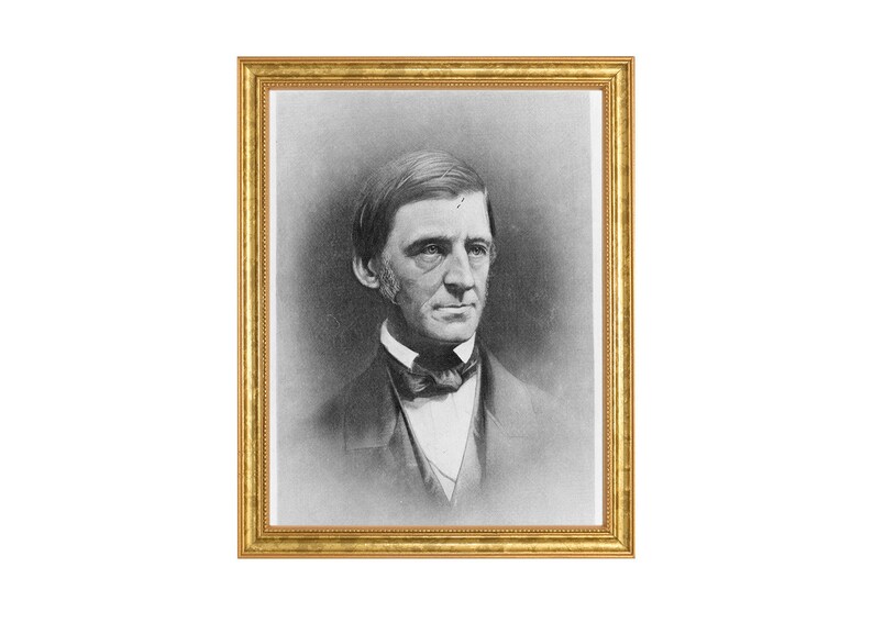 May include: A black and white portrait of a man in a framed photograph. The man is wearing a dark suit with a white shirt and a bow tie. He has a serious expression on his face.