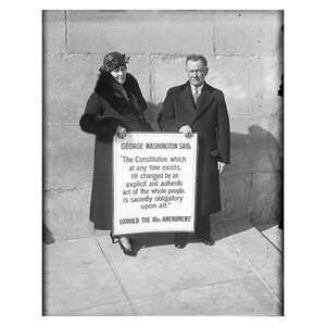 May include: A black and white photo of two people holding a sign that reads "GEORGE WASHINGTON SAID, 'The Constitution which at any time exists, till changed by an explicit and authentic act of the whole people, is sacredly obligatory upon all.' UPHOLD THE 18th AMENDMENT"