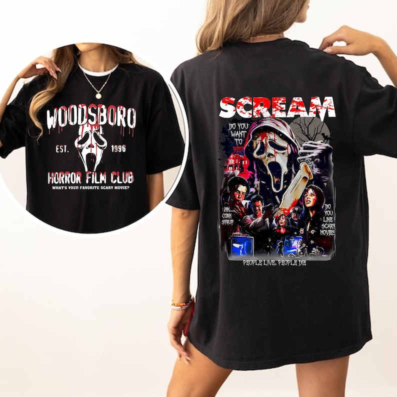 May include: Black t-shirt featuring a graphic from the movie Scream. The front of the shirt has the text "WOODSBORO HORROR FILM CLUB" with a ghost face graphic. The back of the shirt has the word "SCREAM" and other graphics.